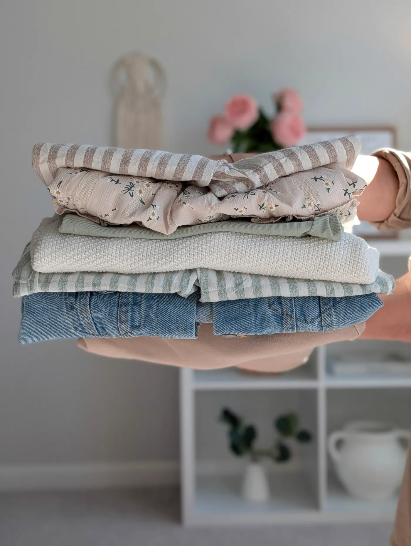 Folded apparel styled in hand